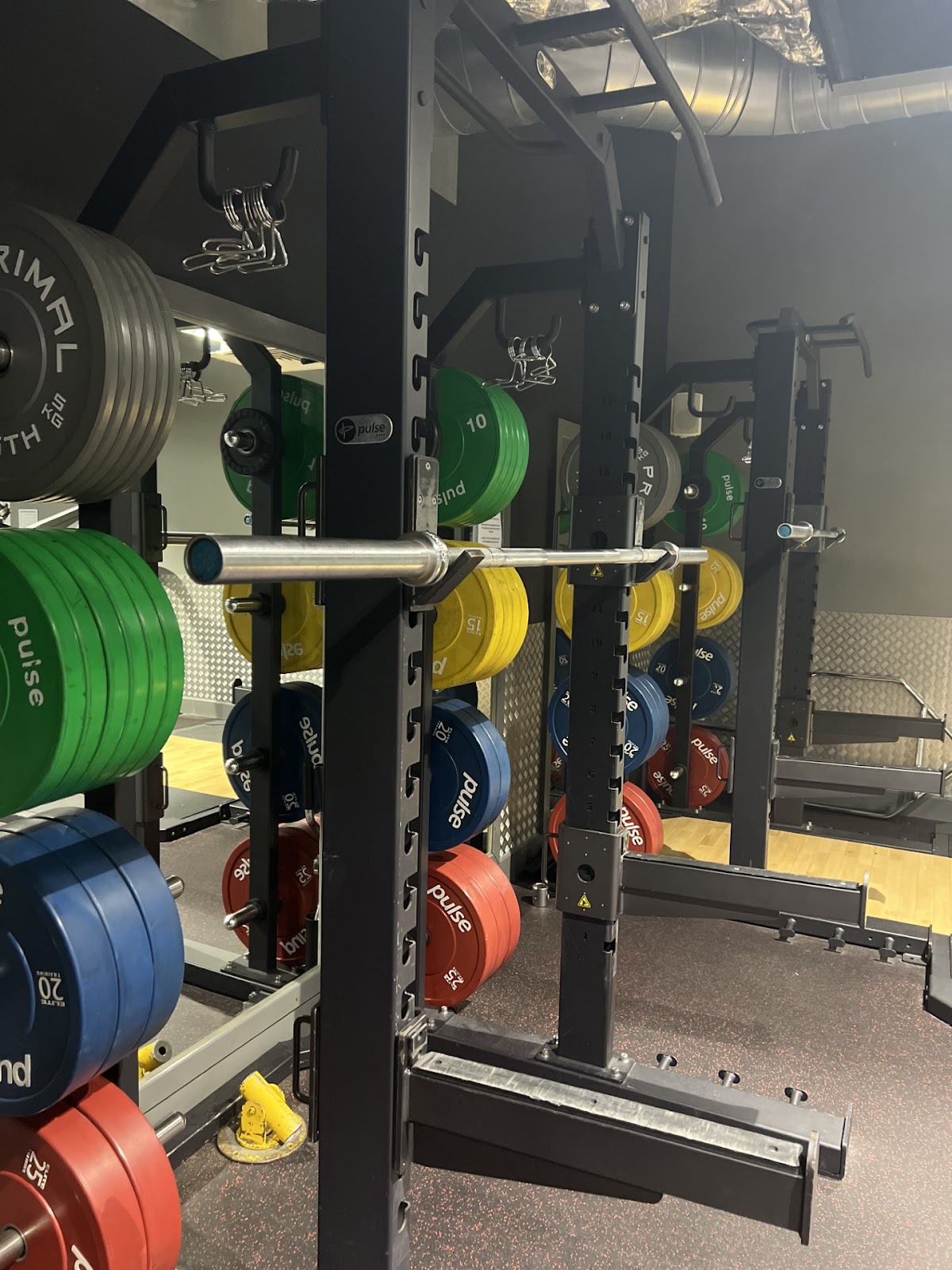 Squat rack with Pulse Fitness bumper plates at Phoenix Pool and Gym, Bradwell